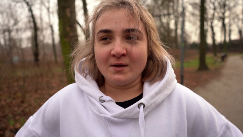 Portrait shooting. Breathes deeply after running.