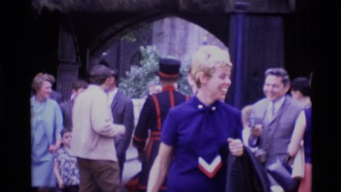 LONDON ENGLAND-1969: Woman And Beefeater Marching Back And Forth