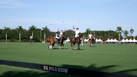 Wellington, Florida/USA - January 19, 2020: Ylvisaker Cup at International Polo Club. Polo jockeys on horseback playing on the 300 yards long field, footage. Polo game footage.