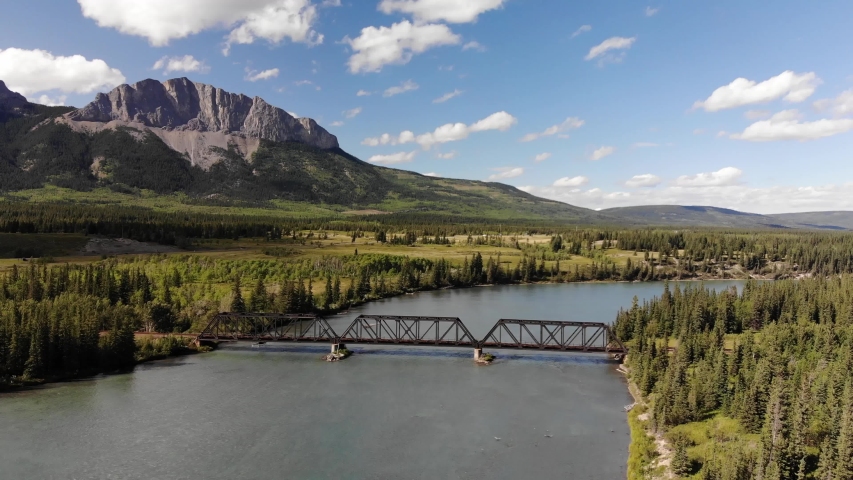 Drone flight over the Bow River near Mt Yamnuska and the Banff National Park in Alberta Canada 