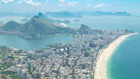 Aerial panorama timelapse of Rio de Janeiro, Brazil. View of Ipanema, Leblon, Lagoa lake, Copacabana, the beach and the ocean. Sugarloaf peak and mountains in the background.