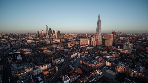 Establishing Bird Eye Aerial View Shot of London UK, London Skyline, The City Panorama, Business District in the background, United Kingdom beautiful day clear sky tracking in
