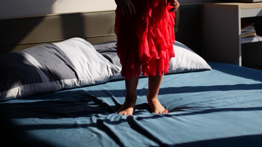 Child jumps on the parent bed and asks for sweets