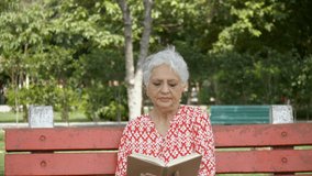 Old Indian couple spending quality time together on Valentine's day in India. Senior man giving a bunch of red roses to an aged woman while celebrating valentine's day together in a park - lifestyl... - Powered by Shutterstock - Get 15% off with code: PIKWIZARD15
