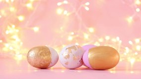 Gold and pink eggs pattern on a light blurry garland. - Powered by Shutterstock - Get 15% off with code: PIKWIZARD15