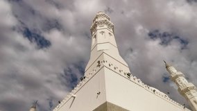 Clips video of Quba Mosque or Masjid Kuba exterior building with cloud movement. Muslim pilgrims visiting Quba Mosque during hajj or umrah season. 