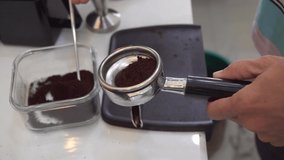 The process of making coffee : tamping coffee footage video 4k.
