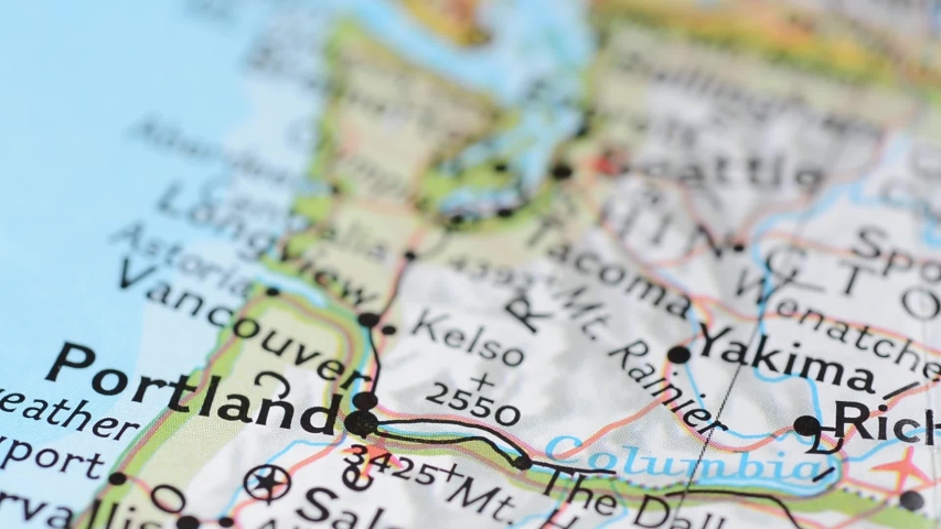 Close up view on the road map with marker around the city of Portland, Oregon