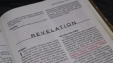 Los Angeles California - January 21, 2020: Holy Bible, New International Version Edition, turning the page to Revelation.