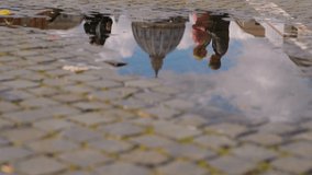 Video of reflection in the puddle. Beautiful young couple hugs and kisses in the center of Rome. 4K video. - Powered by Shutterstock - Get 15% off with code: PIKWIZARD15