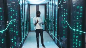 Digitalization of Information. African IT Engineer Controlling Server Cabinet with Tablet. 3D Looped Animation of Data Flow with Glowing Board Lines, Graphic Elements and Numbers Flying at Server - Powered by Shutterstock - Get 15% off with code: PIKWIZARD15