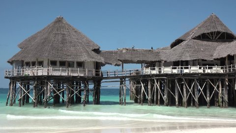 Empty hut on the island of Zanzibar in the Indian Ocean on wooden stilts.
