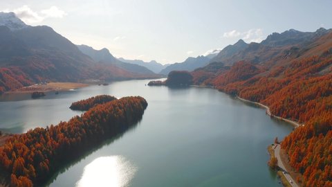 Sunny morning view of Sils Lake (Silsersee). Aerial autumn scene of Swiss Alps, Maloja Region, Upper Engadine, Switzerpand, Europe. Beauty of nature concept background.