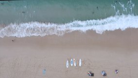 the sea wave on the sand beach and tourist at surin beach Phuket Thailand footage 4k aerial view from drone 