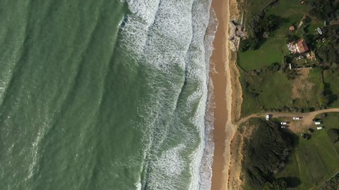 Ocean top view with beautiful waves and yellow sand, located in l'Ile de Ré. French island on west coast.