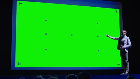 Business Conference Stage: Keynote Speaker Presents New Product to the Audience, Movie Theater Shows Green Screen, Mock-up, Chroma Key. Live Event on Health, Science and Technology
