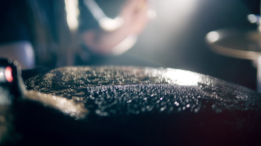 Surface of a wet drum cymbal while being played in a close up Royalty-Free Stock Footage #1045128916
