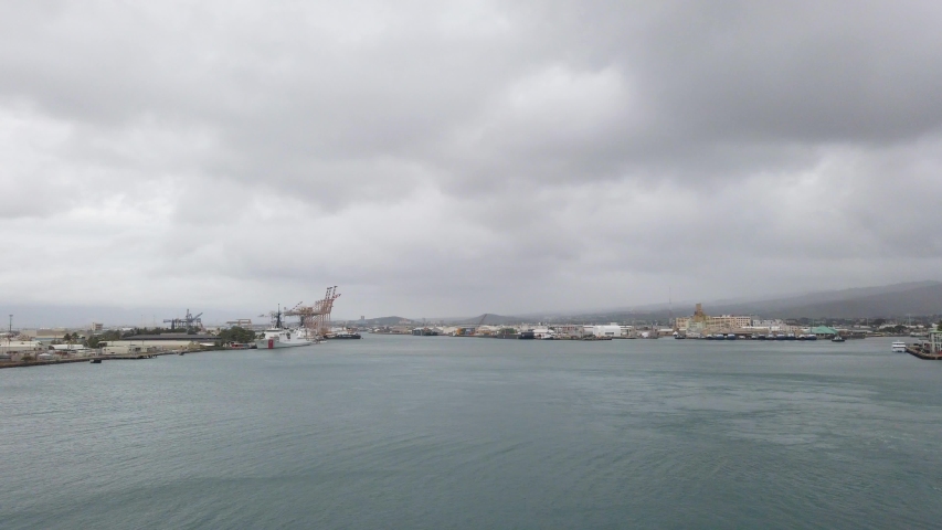 Cruise Terminal in Honolulu, ships dock at piers near the Aloha Tower.