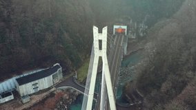 Road bridge in the mountains on the way from Sochi to the resort town of Krasnaya Polyana, Sochi, Russia. Drone video.