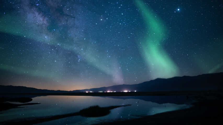 Aurora Borealis Milky Way Galaxy Reflections on Lake Simulated Nothern Lights Royalty-Free Stock Footage #1045146688