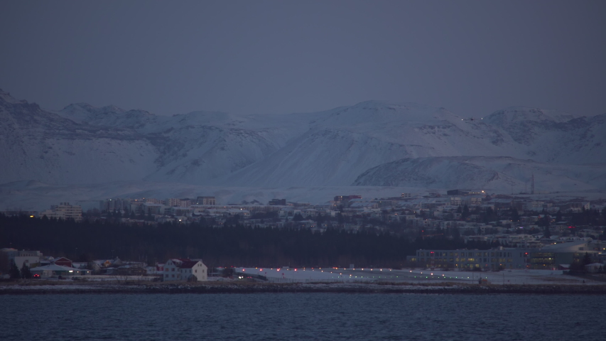 Small plane landing at Reykjavik Iceland airport winter dusk.mov
