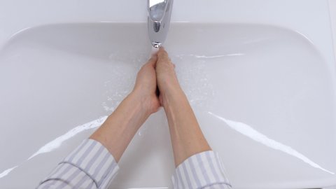 Female Hands Washing In Basin