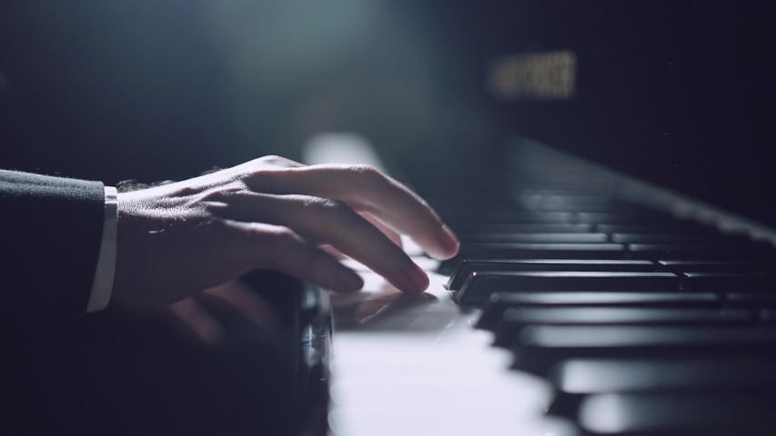 Professional pianist. The pianist performs playing a grand piano. Hands close up | Shutterstock HD Video #1045165597