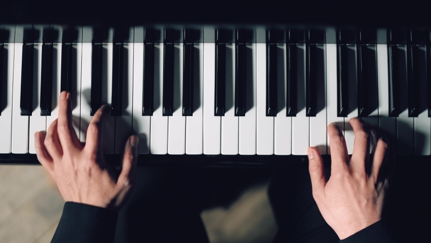 Close-up of pianist's hands professionally play the piano | Shutterstock HD Video #1045165627
