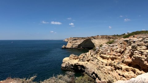 POV of a coastal trail in the mediterranean coast of Algarve, south of Portugal