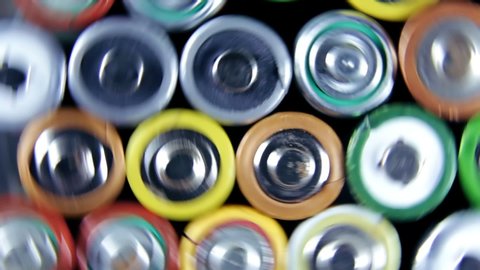 Different types of used batteries in heap. High danger for the environment. Batteries background