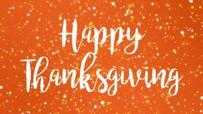 Sparkly orange Happy Thanksgiving greeting card video animation with handwritten text and flickering colorful glitter light particles.