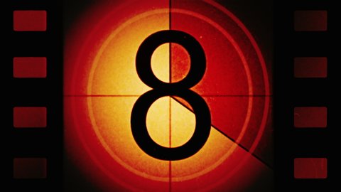 Red Universal Countdown Leader. High contrast. Film perforations or perfs. Countdown Clock from 10 to 0. Old film rolling effect with details, scratches, markers, grain. 4K Film Burn Effect. Film reel