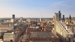 manchester city time lapse sunset to night aerial panoramic view england uk zoom out