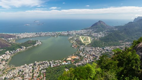 Panning aerial timelapse hyperlapse of the Ipanema in Rio de Janeiro, Brazil. View city downtown, Lagoa lake, Leblon, Copacabana and the beach. Peak and hills in the background