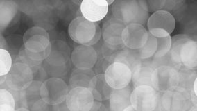 Beautiful black and white shiny round bokeh 4k video abstract Christmas background