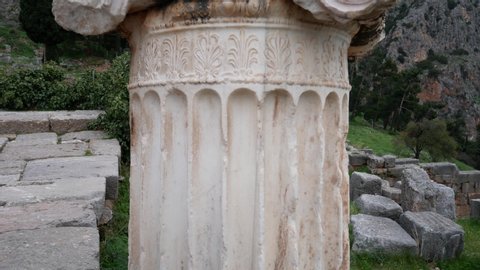 ionic column in the archaeological site of Delphi along the slope of Mount Parnassus, UNESCO World Heritage, Greece.