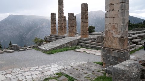 Ruins of the ancient temple of Apollo, archaeological site of Delphi along the slope of Mount Parnassus, UNESCO World Heritage, Greece.
