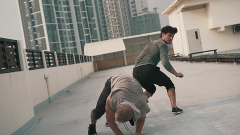 Martial Arts Street Fight scene on rooftop in urban environment.