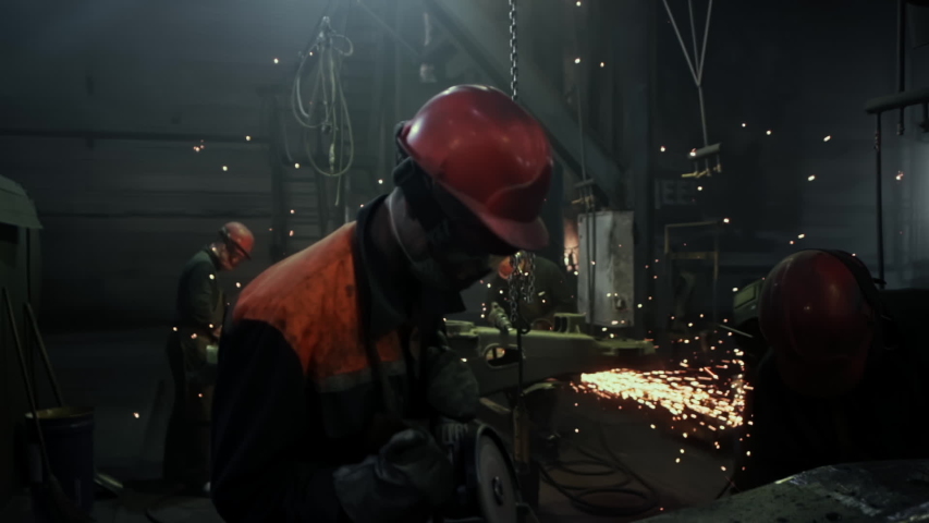 Manufacture of Railcar or Carriage, Train Wagon Production, Factory Workers are Welding in Protective Helmets and Glasses, Beautiful Epic Shot, Dolly Out, Slow Motion Royalty-Free Stock Footage #1045233025