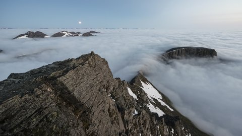 Moonset over Sunnmore Alps mountain with inversion