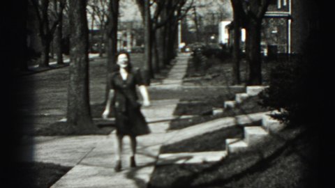 HARRISBURG PENNSYLVANIA USA-1975: A Lady From The 1930 To 1940 Era Walking Down The Street