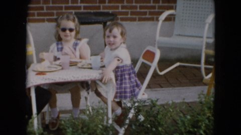 MIDDLETOWN PENNSYLVANIA-1975: Children Table Outdoors Folding Chairs Sunny Sunglasses Smiling Food Anklets Toddler