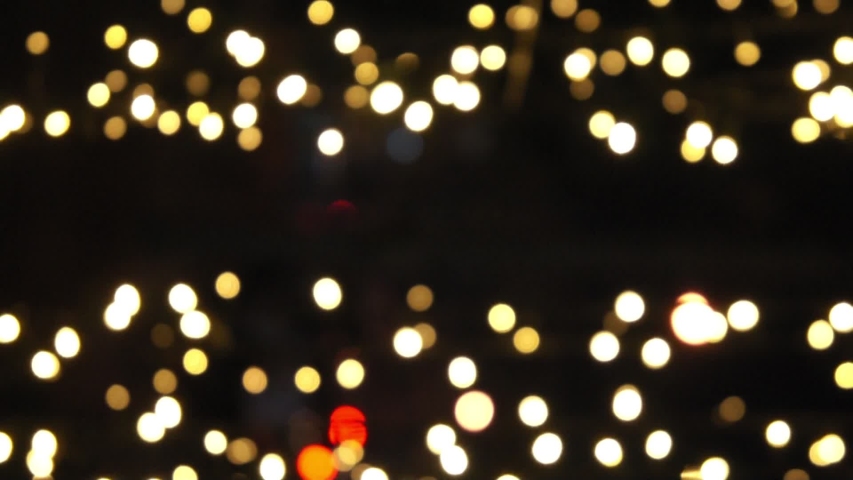 moving illuminated and flashing lighting with night bokeh bakcground