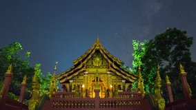 Time lapse video 4K, Beautiful Milky way and clouds moving at night view point Wat Phra That Doi Phra Chan the north of Thailand, Mae Tha district, Lampang.	