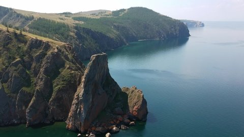 The North Cape of the island Olkhon, lake Baikal. The Nature Of Russia. Drone flies to the rocks over the water. Video from the air. 