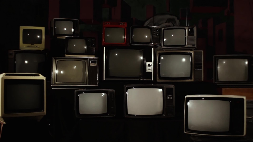 Broken Old TVs with Color Bars and Five Retro TVs turning on Green Screens. Zoom In. You can Replace Green Screen with the Footage or Picture you Want with “Keying” effect in After Effects. Royalty-Free Stock Footage #1045287769