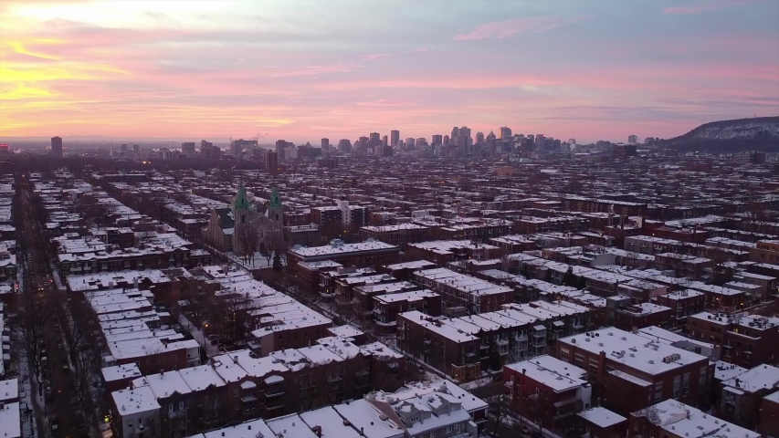 Sunrise in Montreal Canada with the view of downtown building and a catholic church