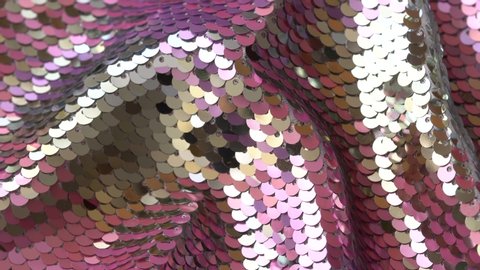 Shiny sequined fabric texture with pink and silver paillettes