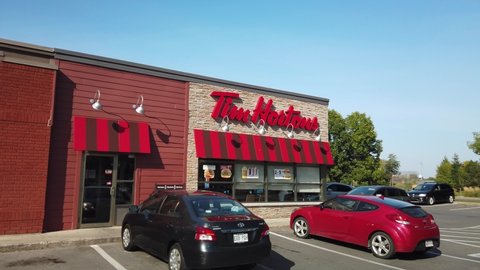 MONTREAL, CANADA - OCTOBER 2019: Smooth display of Tim Hortons coffee shop franchise branch