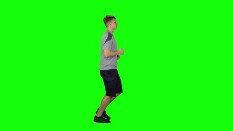 Young man goes then starts to run, Chroma Key. Profile side view